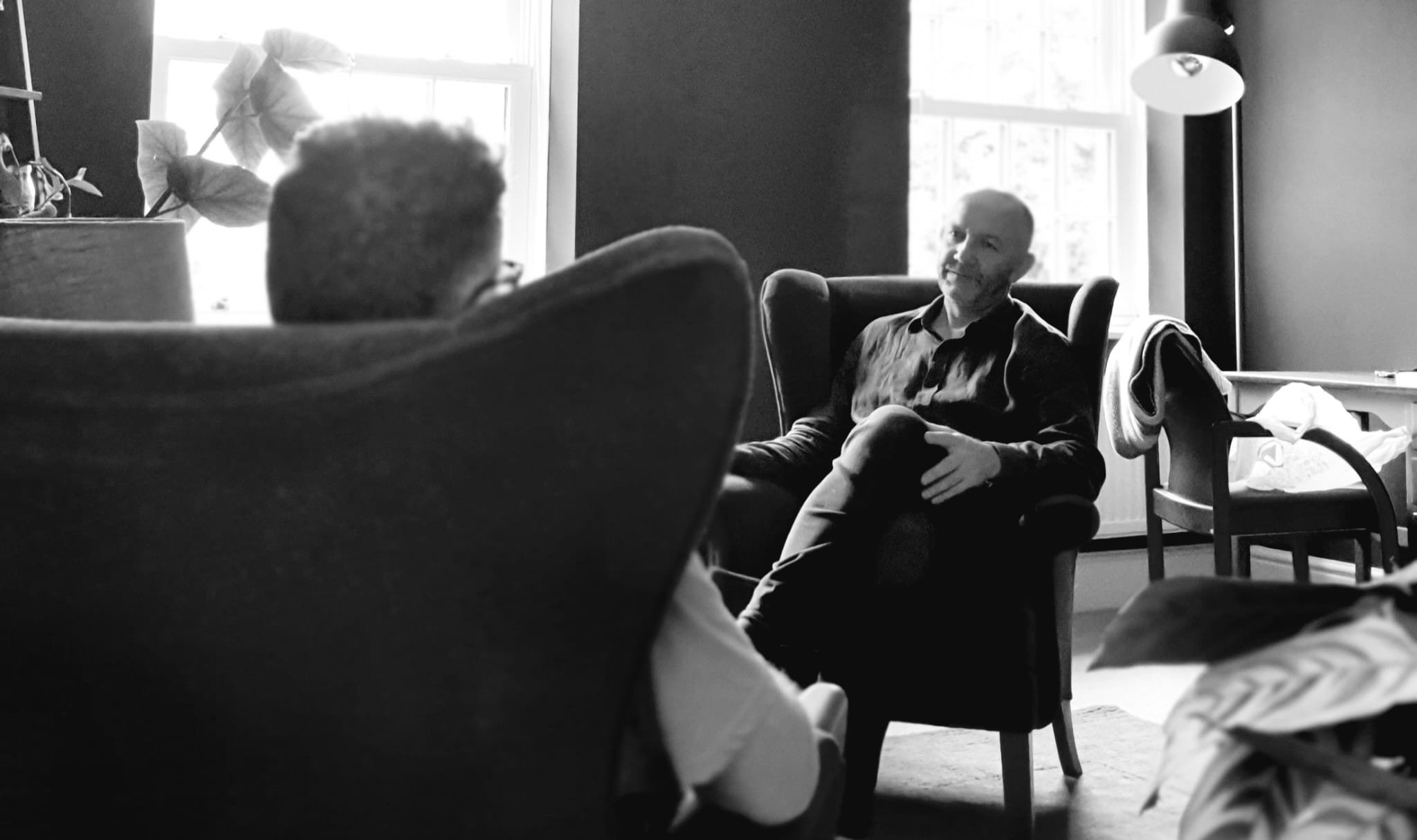 Two people talking in a therapy room