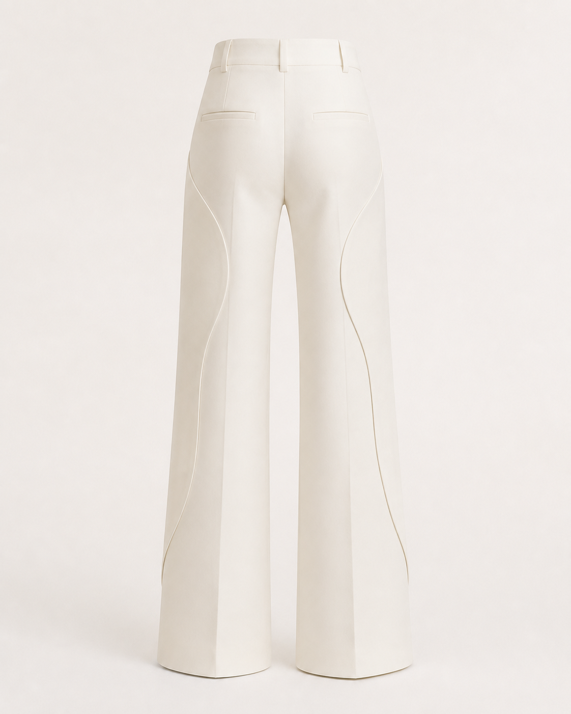 Back view of the ivory Column Trouser showing its structured waist and continuous curved construction.