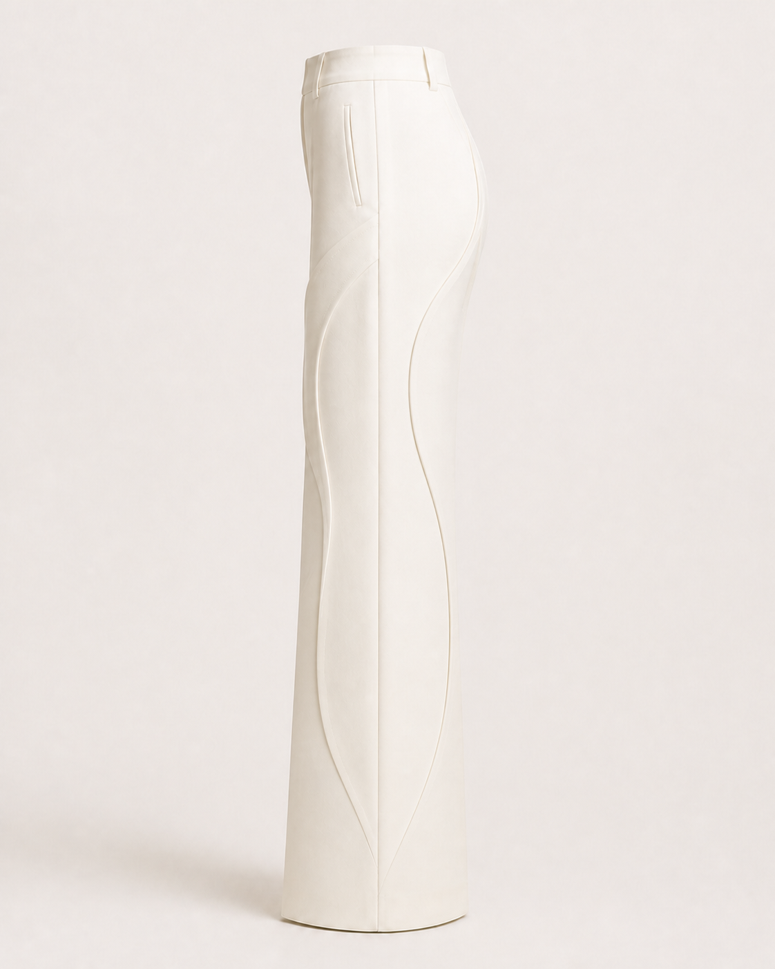 Side view of the Column Trouser showing front and rear curved seams approaching the side seam.