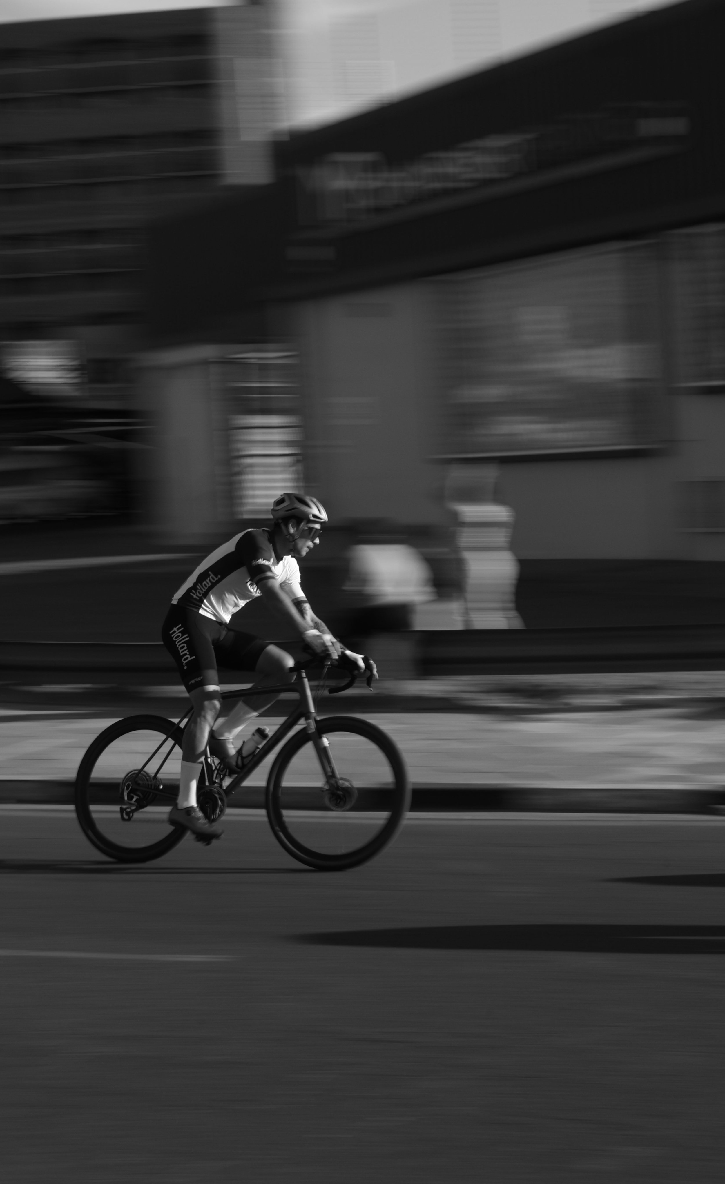 Photograph of a man riding a bike