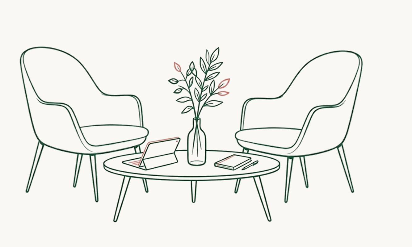 Line drawing of two armchairs facing each other with a coffee table in between. The table has a laptop, a vase with leaves, a closed book, and a pen on it.