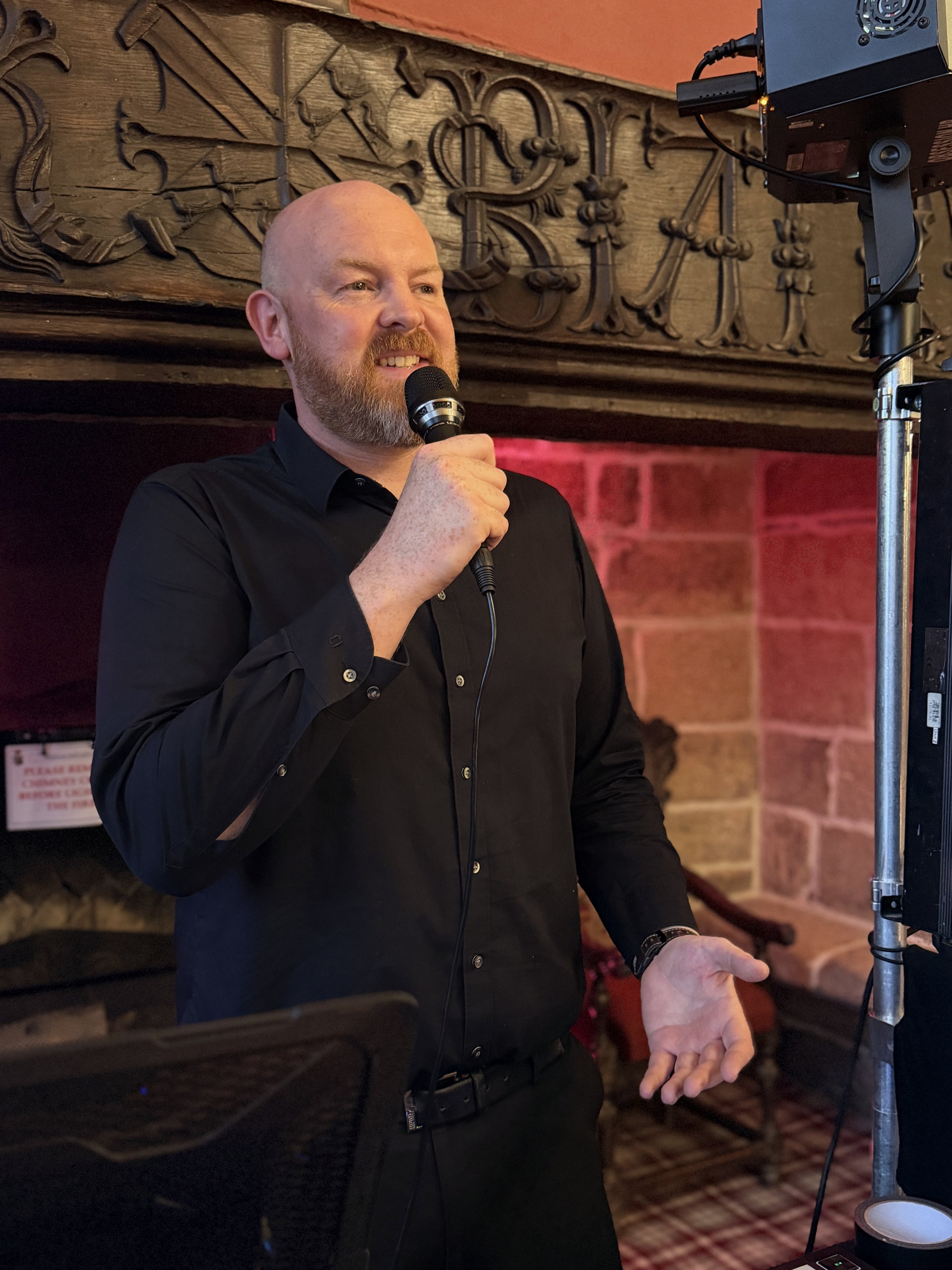 Allan, founder of Atmos, speaking at an event in a Yorkshire venue.