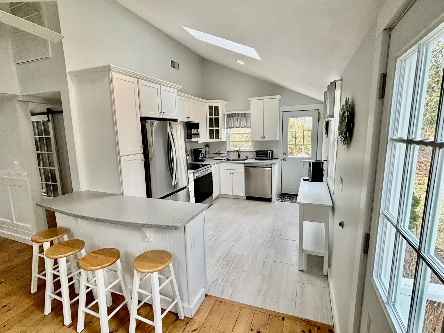 Kitchen with island and counter seating