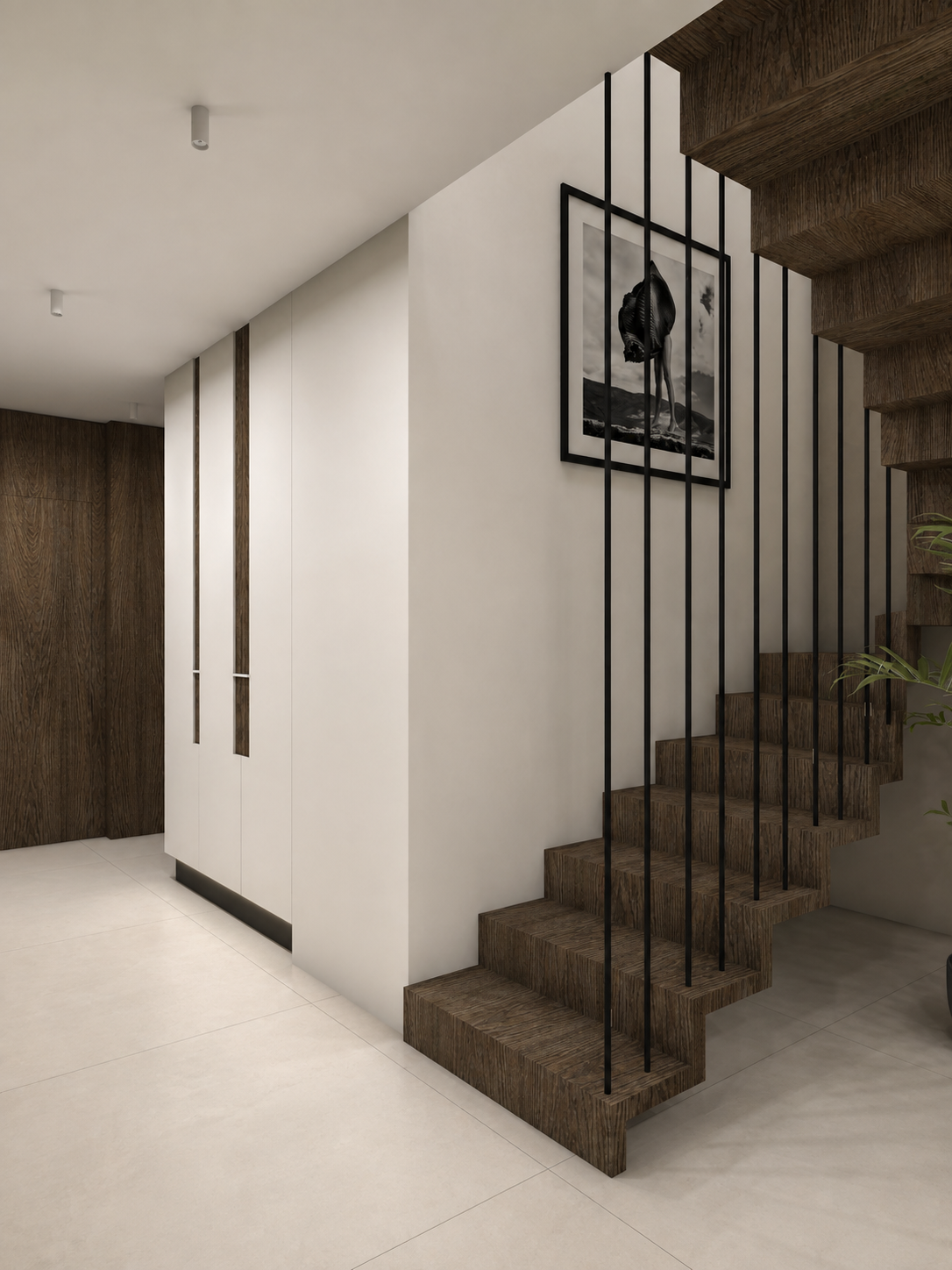 Drewniane schody z czarną balustradą w jasnym wnętrzu nowoczesnego apartamentu.