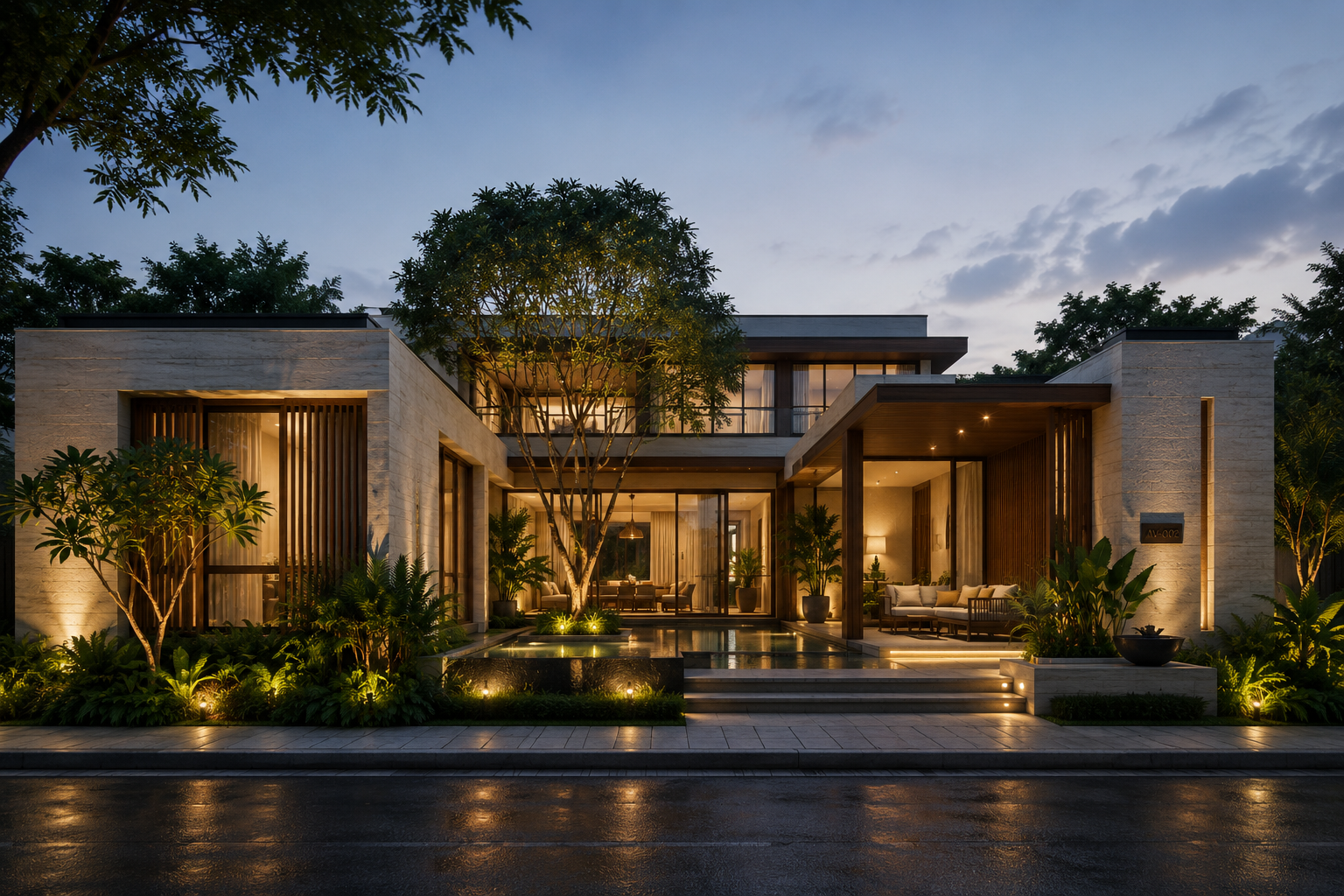 Modern house at dusk with outdoor seating and landscape lighting, lush greenery, and a large tree in the front yard.
