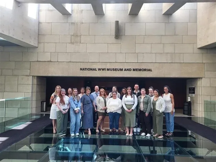 Group photo of visitors at the National WWI Museum and Memorial entrance