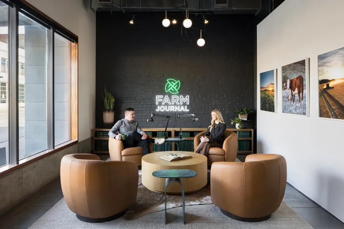 Comfortable meeting area with four oversized chairs and coffee table