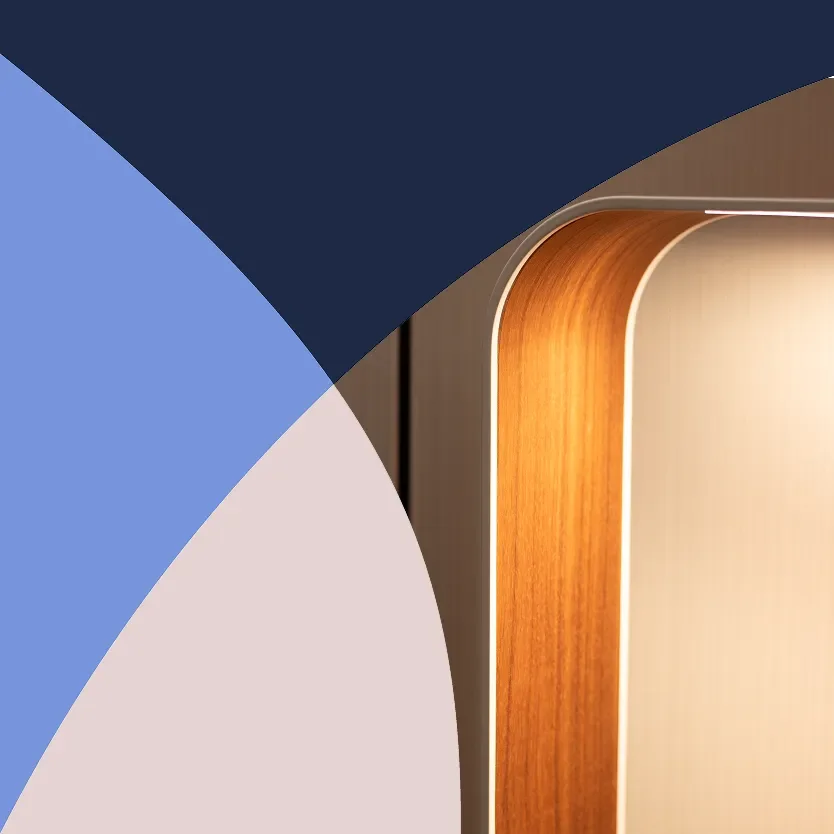 Abstract geometric overlay with navy blue, periwinkle, and pale pink shapes beside a close-up of a warm wood-paneled modern interior.