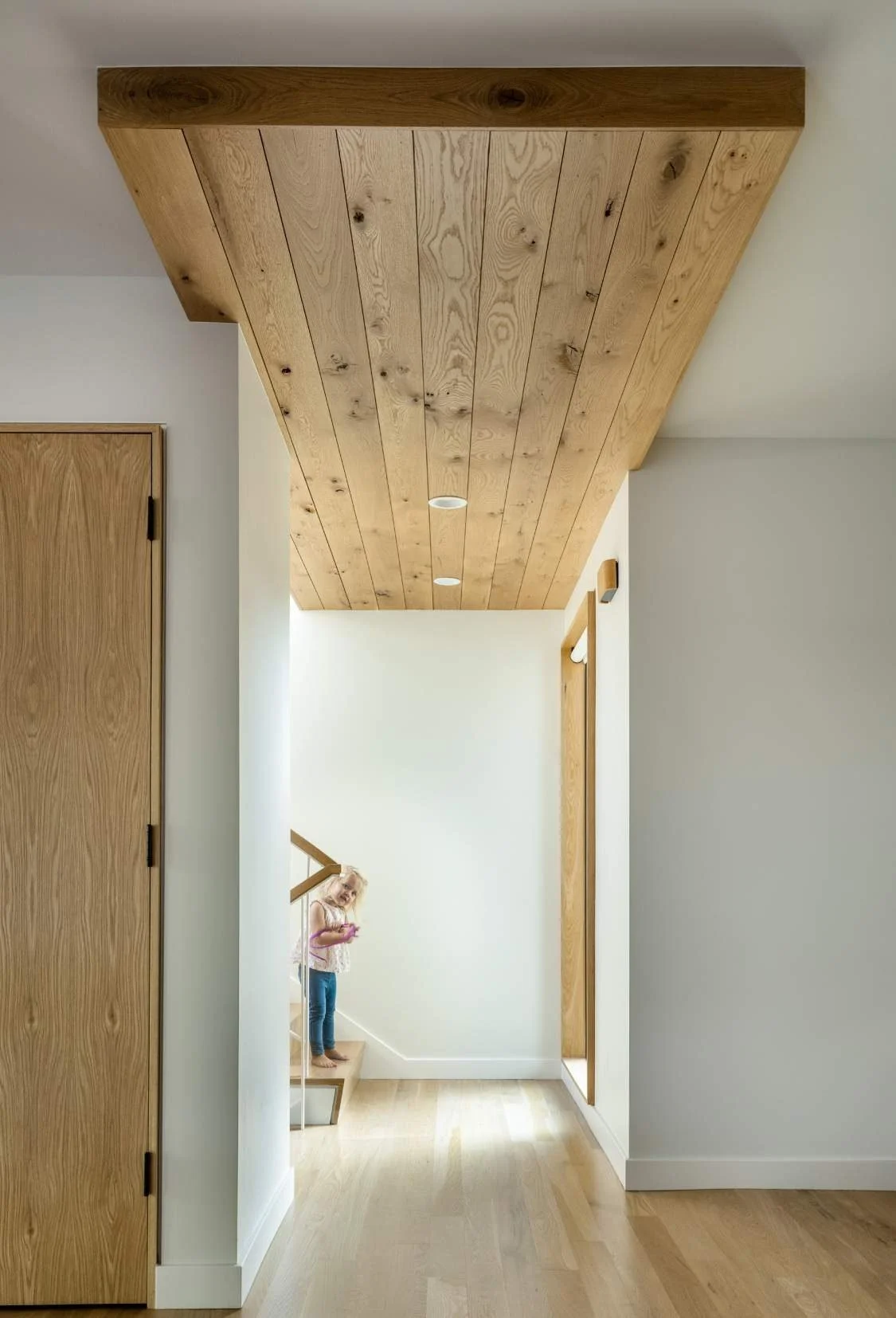 The oak ceiling detail bridges between the original structure and the addition.
