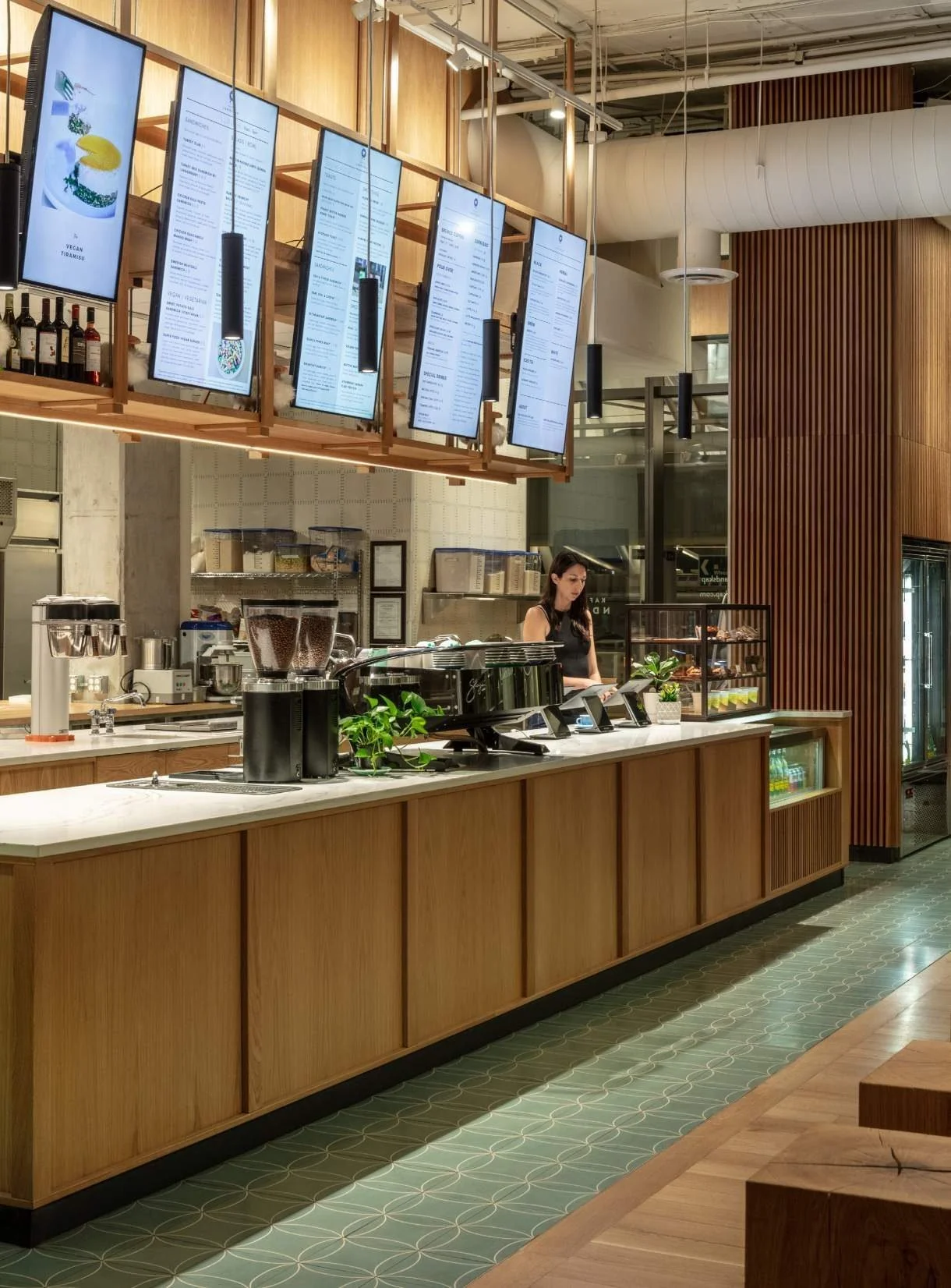 Swedish cement tile in colorful, organic patterns clads the bakery floor.