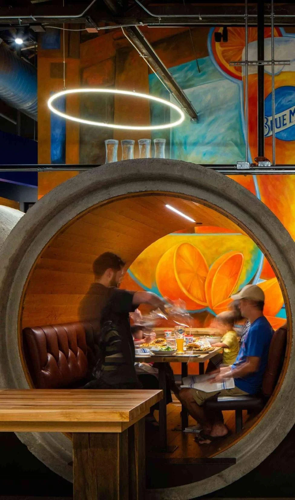 The booths give scale and intimacy to an otherwise expansive room.