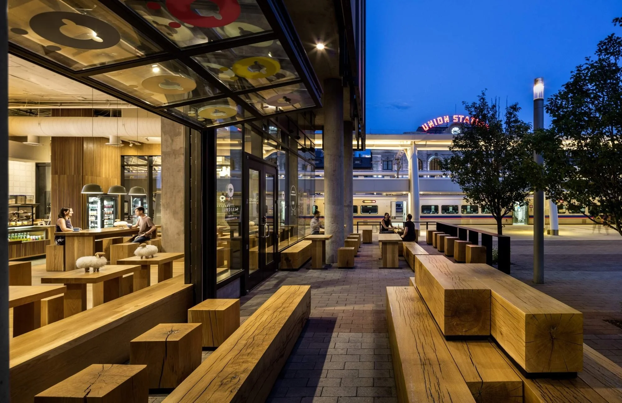 The patio sits directly across from the train, bus, and light rail station.
