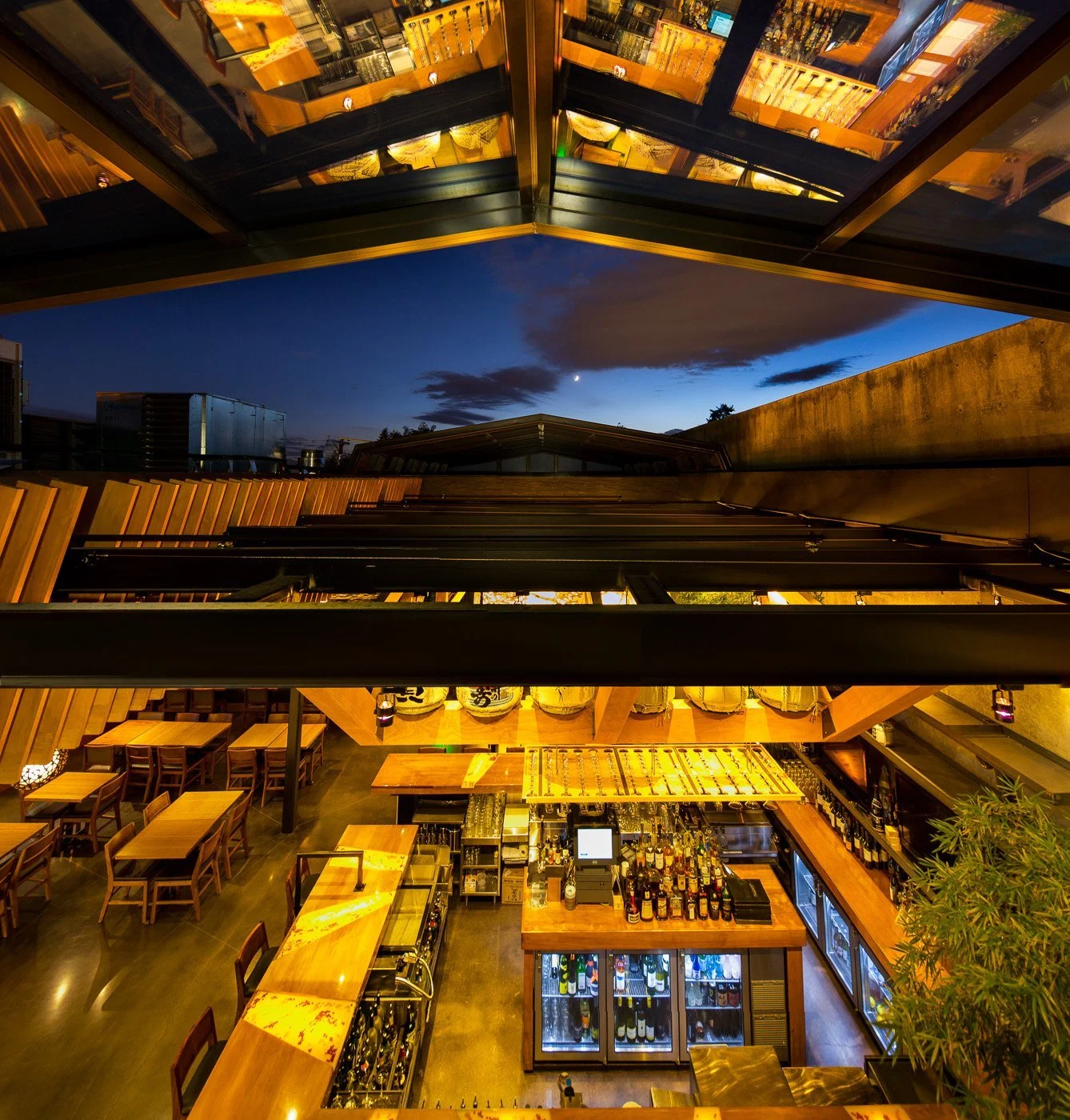 Looking up through the retracted glass roof to the evening sky.