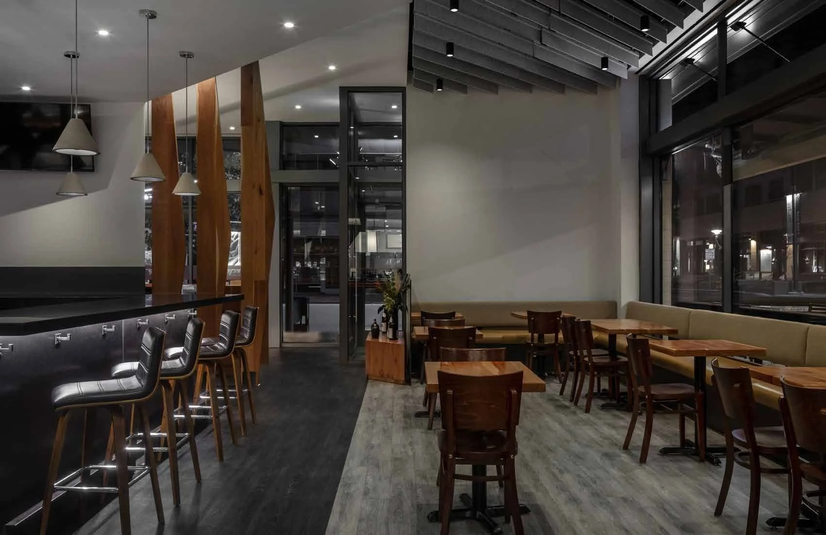 12'-6" floor-to-ceiling windows daylight the space through the day and early evening.