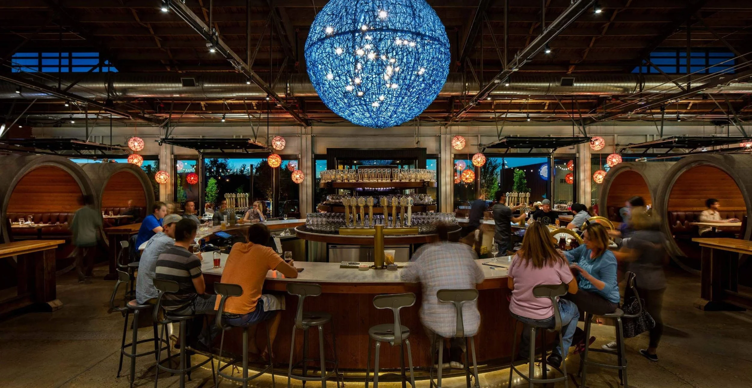 The bar sits at the center of the plan, with the brew house directly beyond.