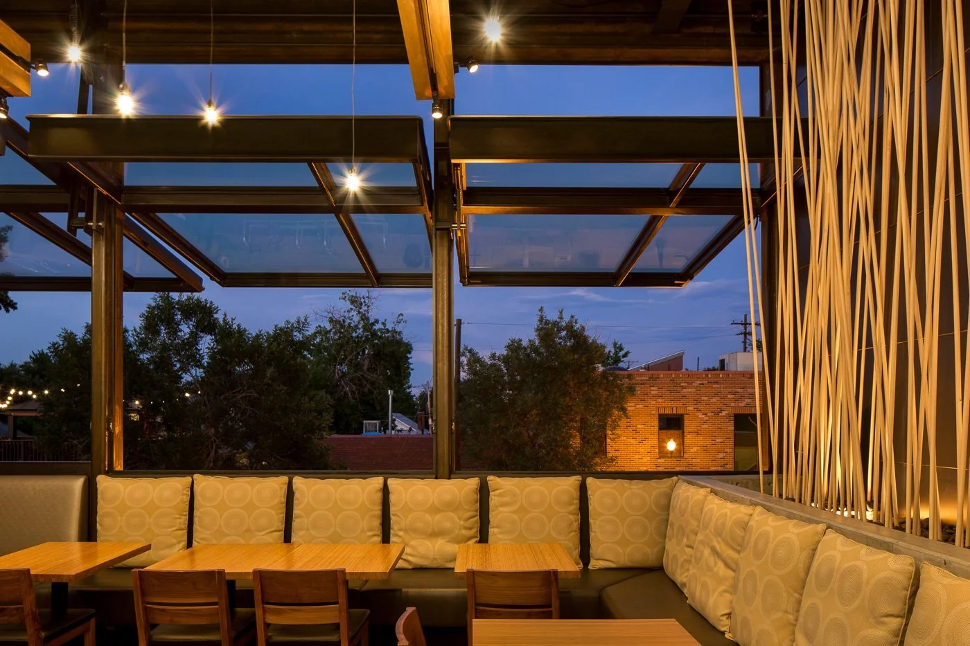 The 35-foot glass roof slides open to put the dining room under the sky.
