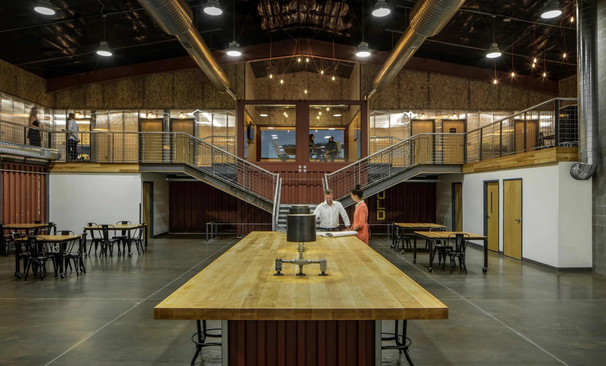 The heart of the building is activated by the central community work table.