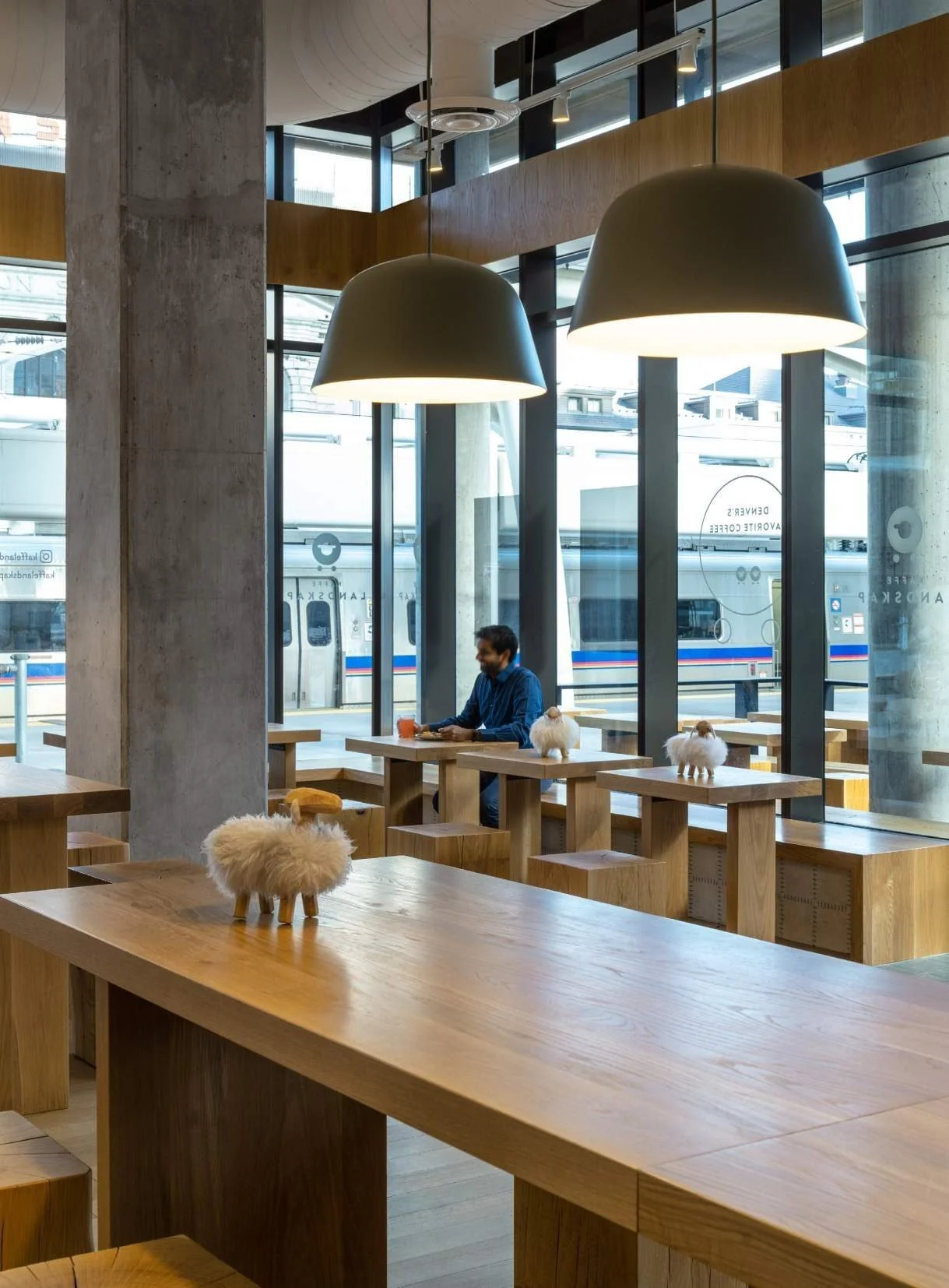 Pendants are set low to create intimacy within an otherwise open space.