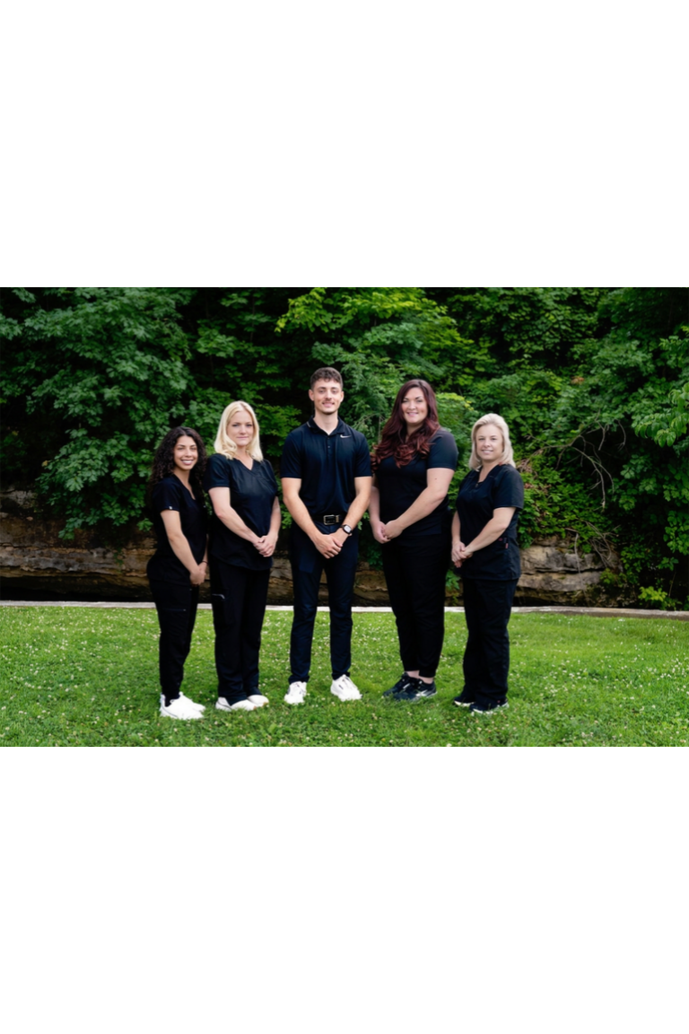 Dr. Samuel Reed with the five-person Elevate Life team outdoors