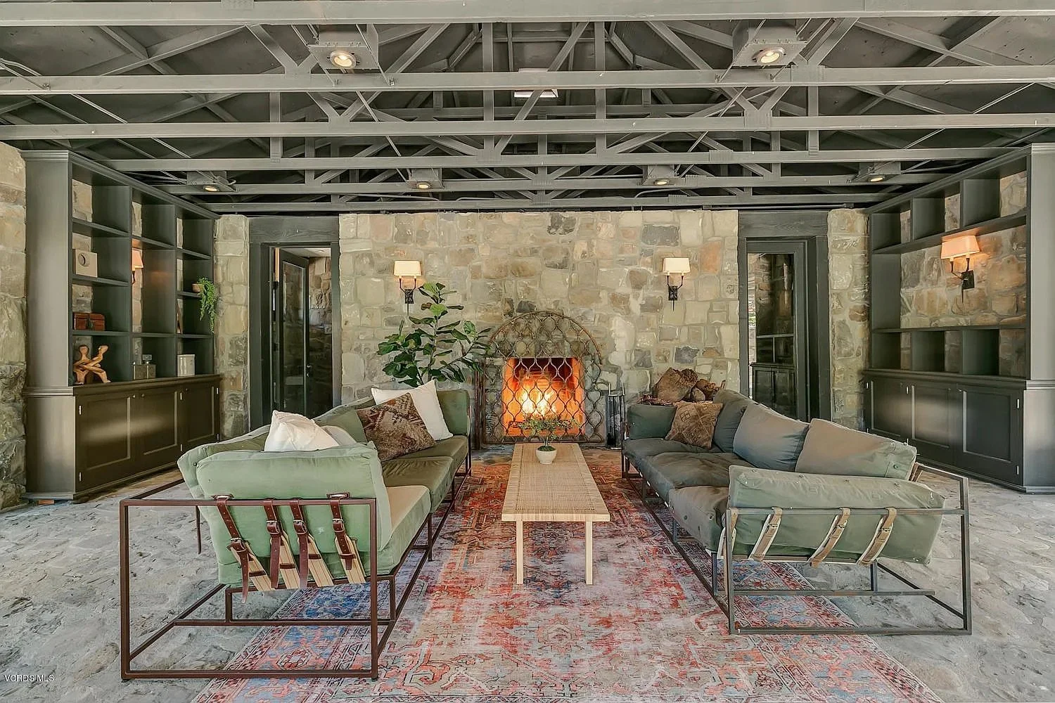 Stone fireplace and custom living room in an Ojai, California luxury home