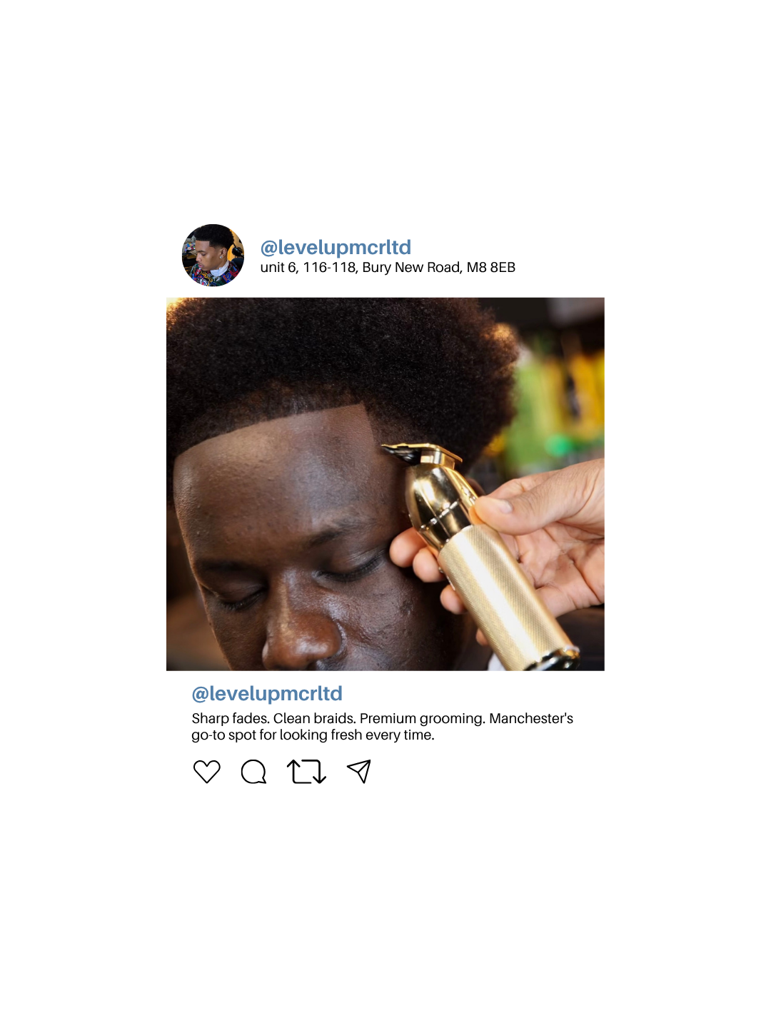 Close-up of a man with natural hair getting a grooming shave with an electric trimmer, in a barbershop or grooming salon.