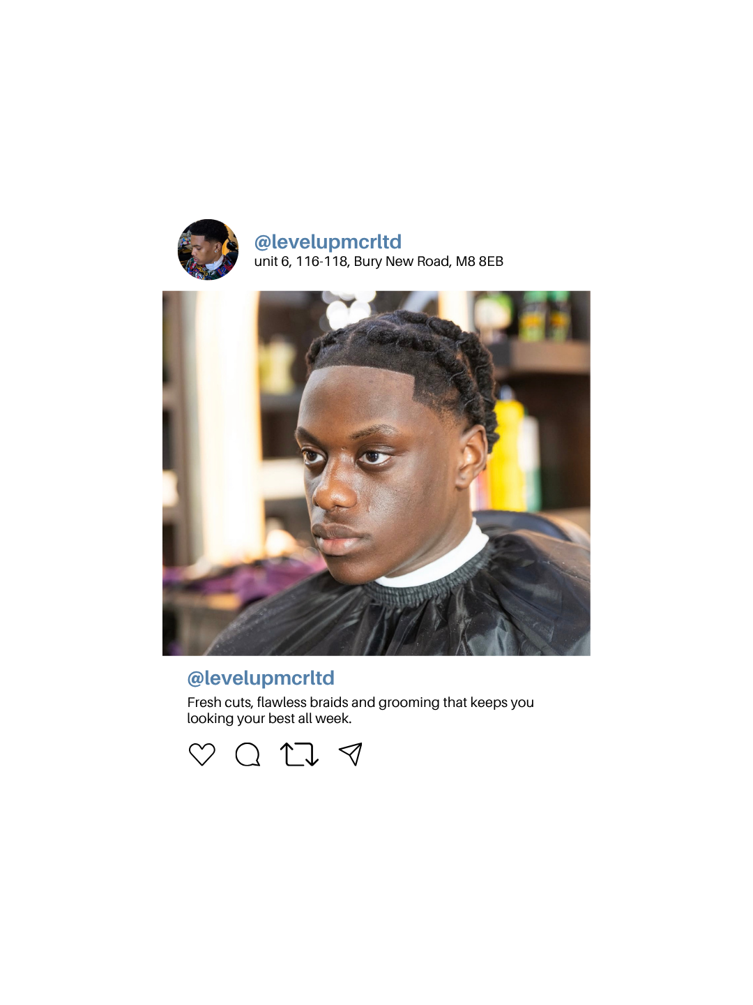 A young man with fresh braids and a clean fade haircut sitting in a barbershop. The barber is out of frame. The background has shelves with hair care products.