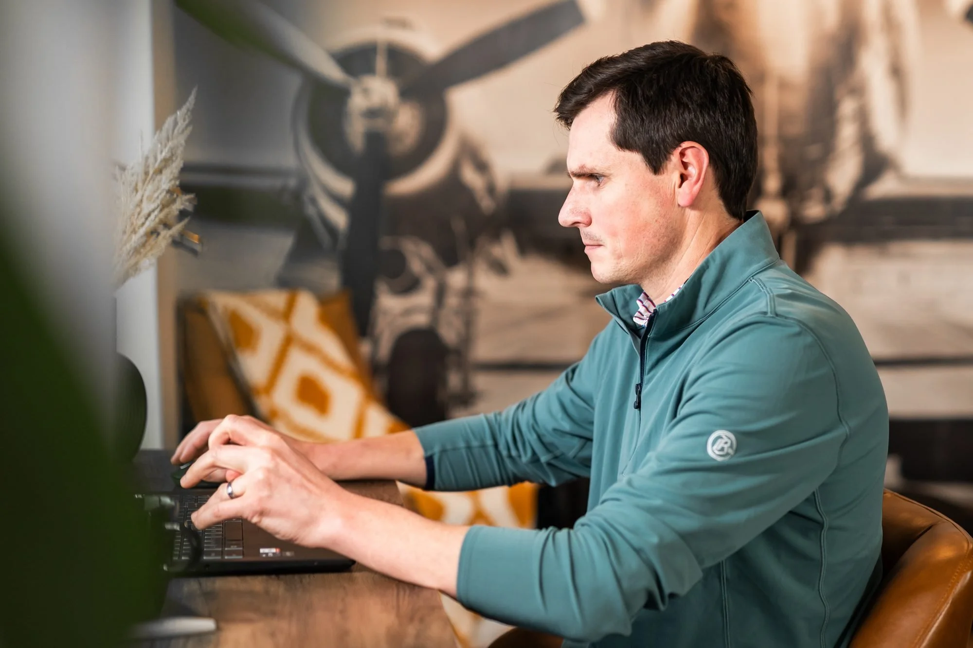 Rob Holdcroft working through a client plan at his laptop