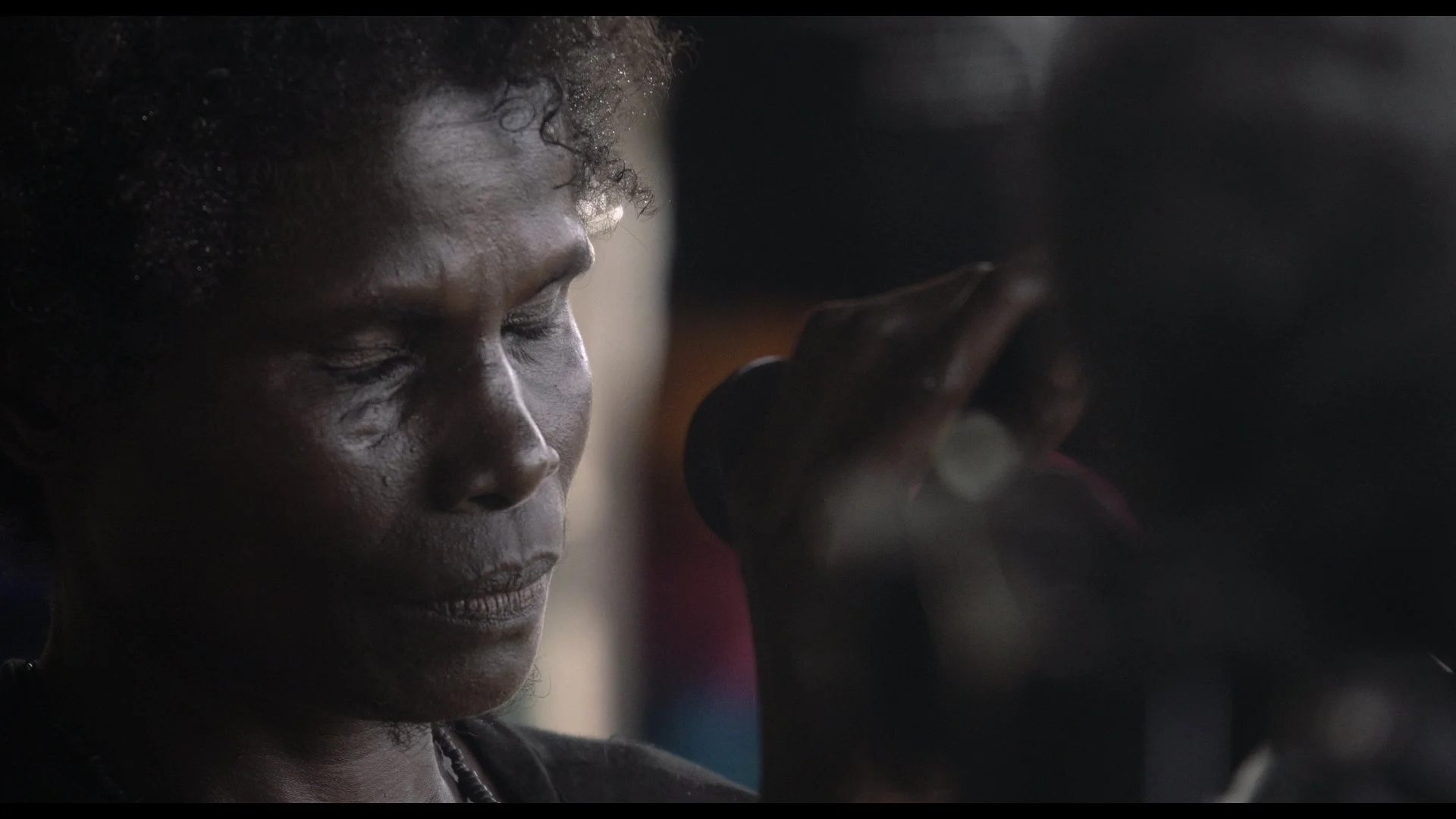 Ophir - woman crying at mic.jpg