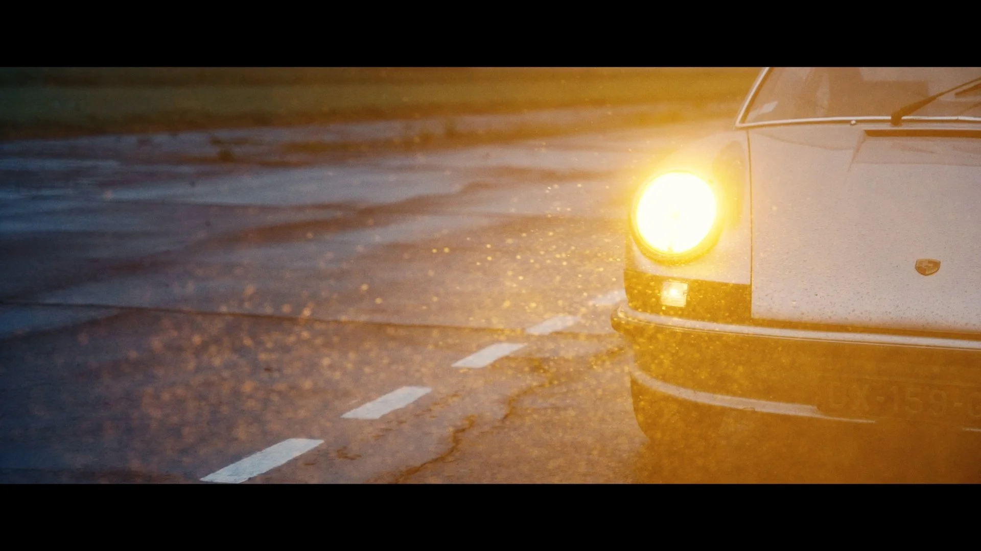 The Automologist - car light under rain.jpg
