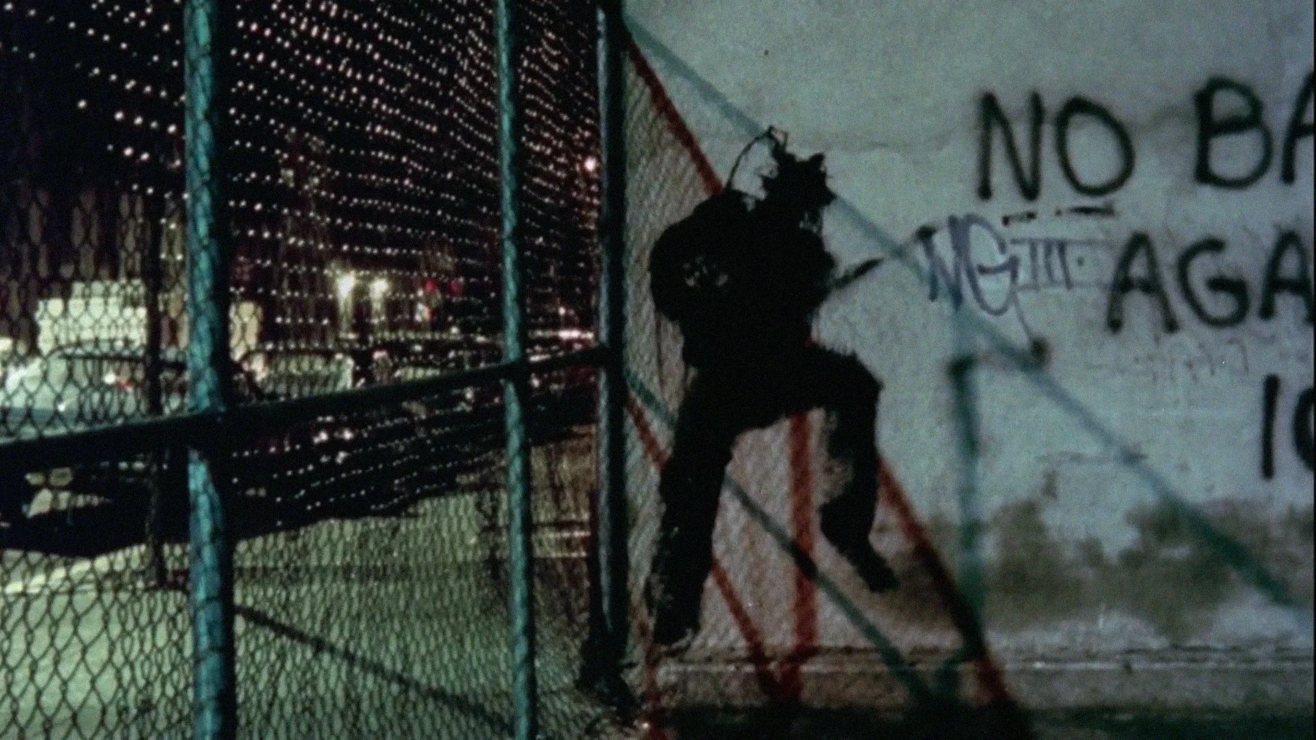 NIGHTLIFE - shadowman green fence.jpg