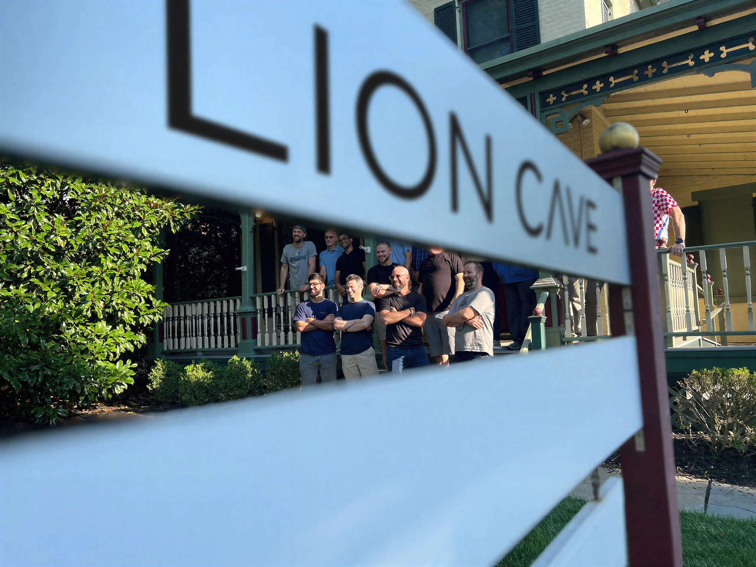 People gathering outside Lion Cave during a company event.