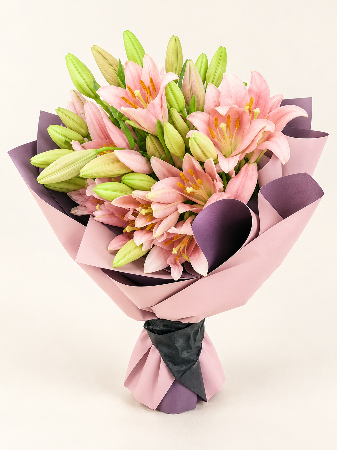 Pink lily bouquet in blush wrapping.png