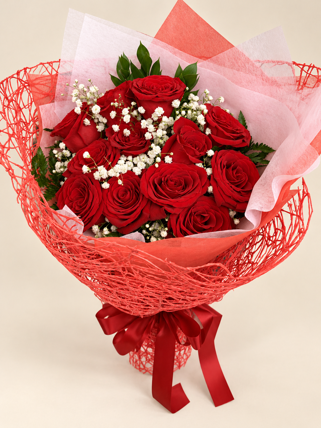 Wrapped red roses and baby's breath.png