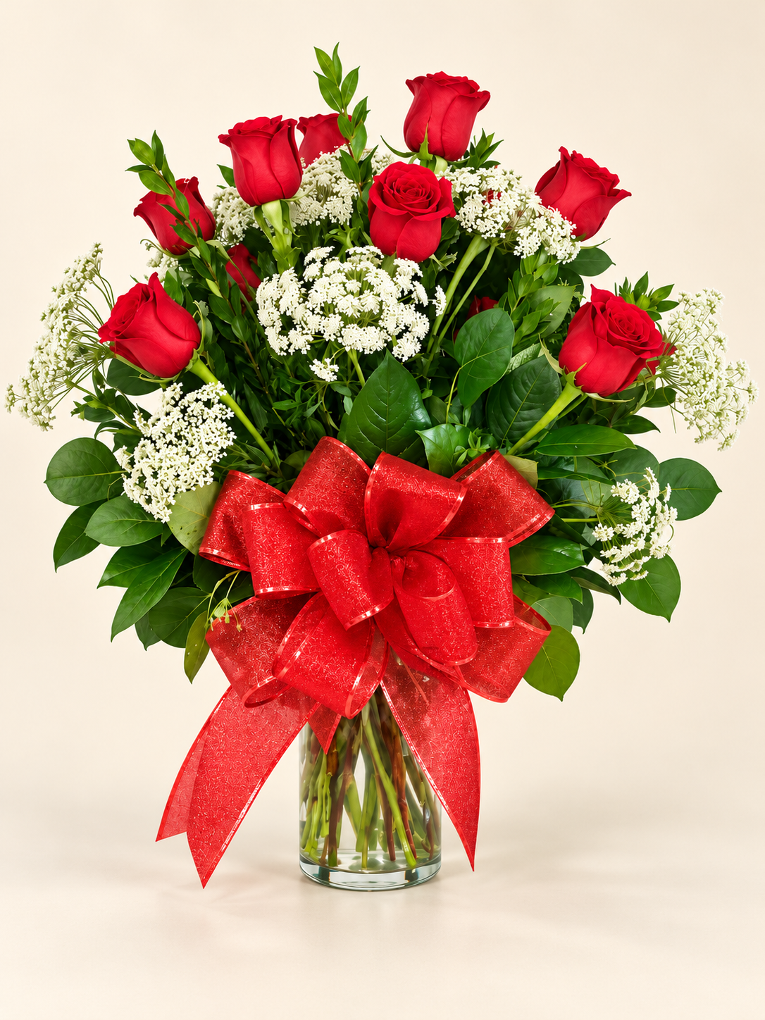 Red rose vase arrangement with red bow.png