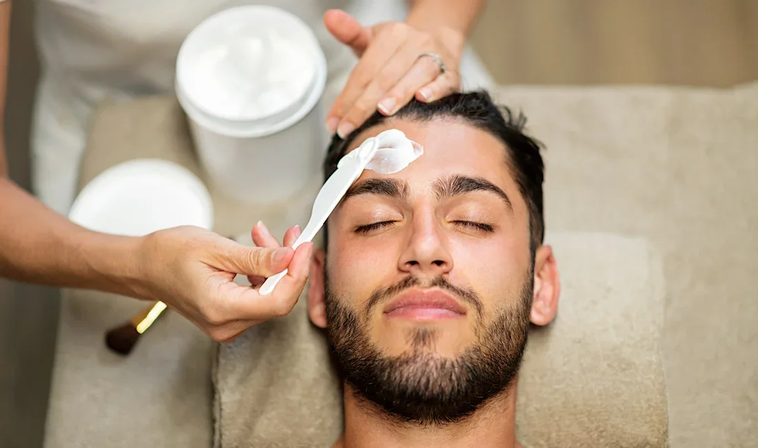 Man receiving a facial treatment