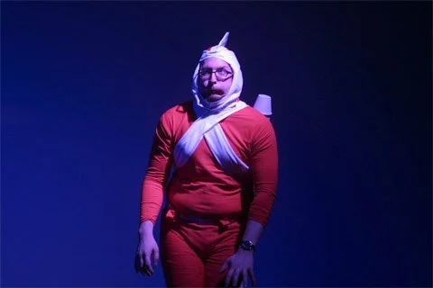 Man dressed as Adam Strange lands on the moon and encounters a moon slug.
