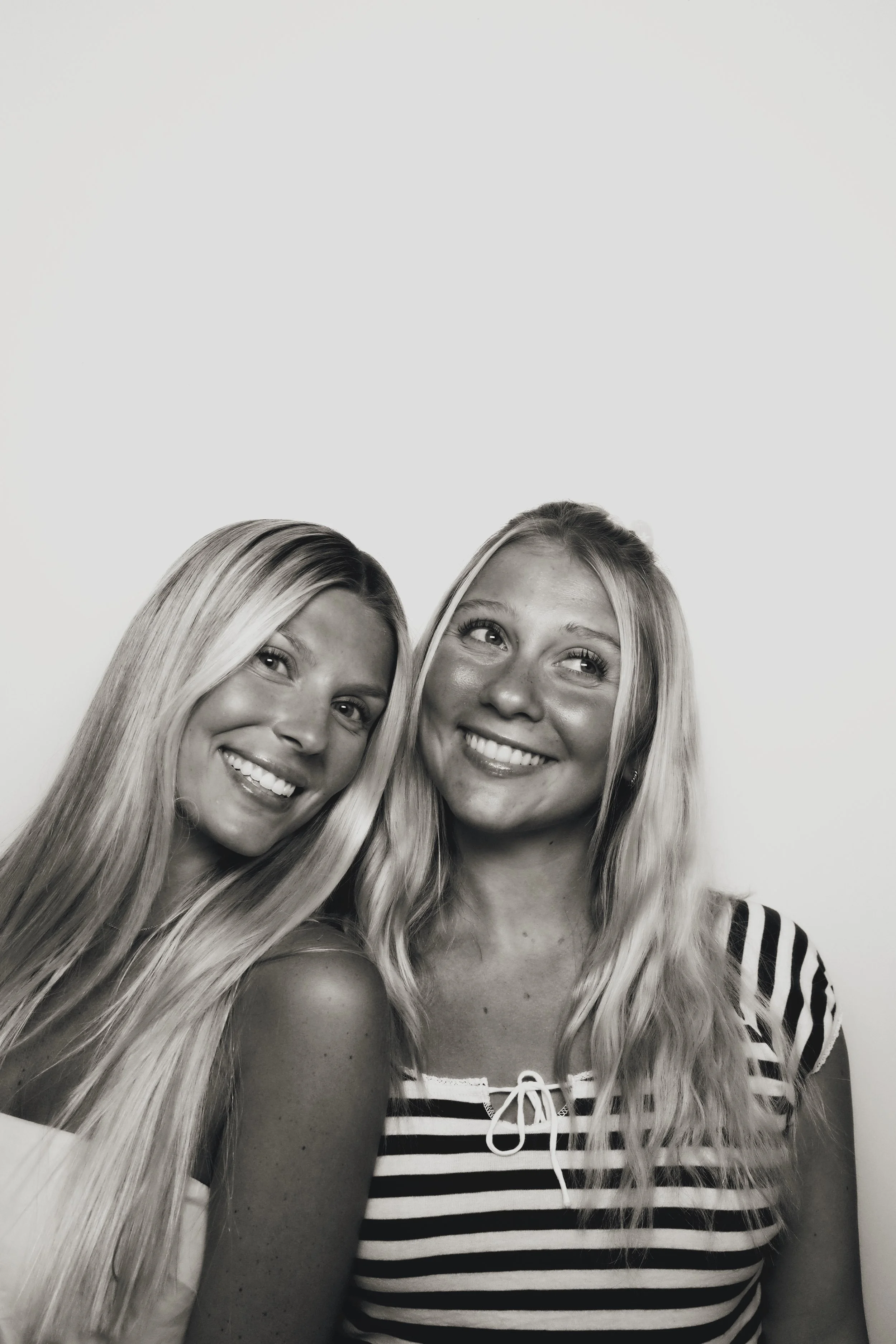 Vintage-style photo strip of two guests from an 801 Booth photo booth rental in Utah