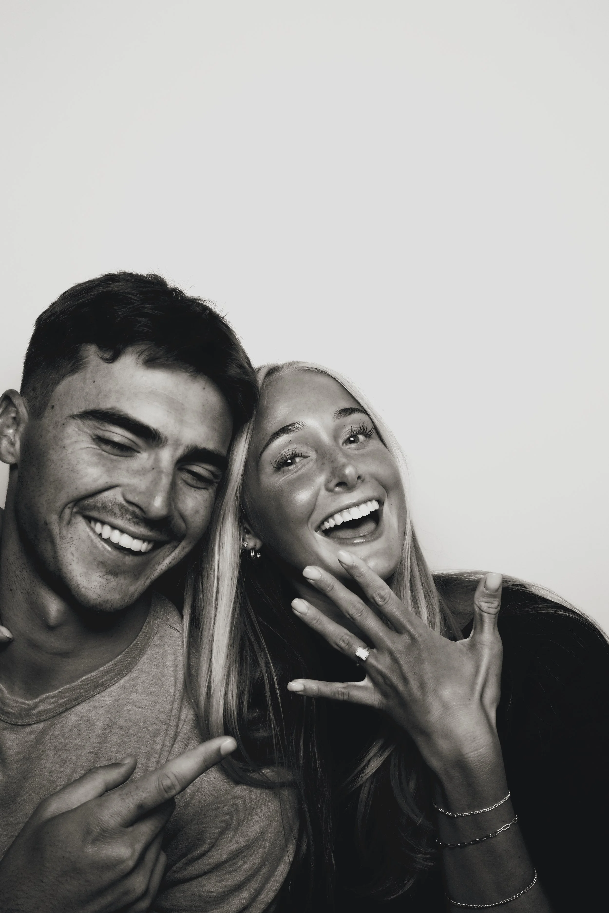 Friends making peace signs in a vintage-style photo strip from 801 Booth, a Utah photo booth rental
