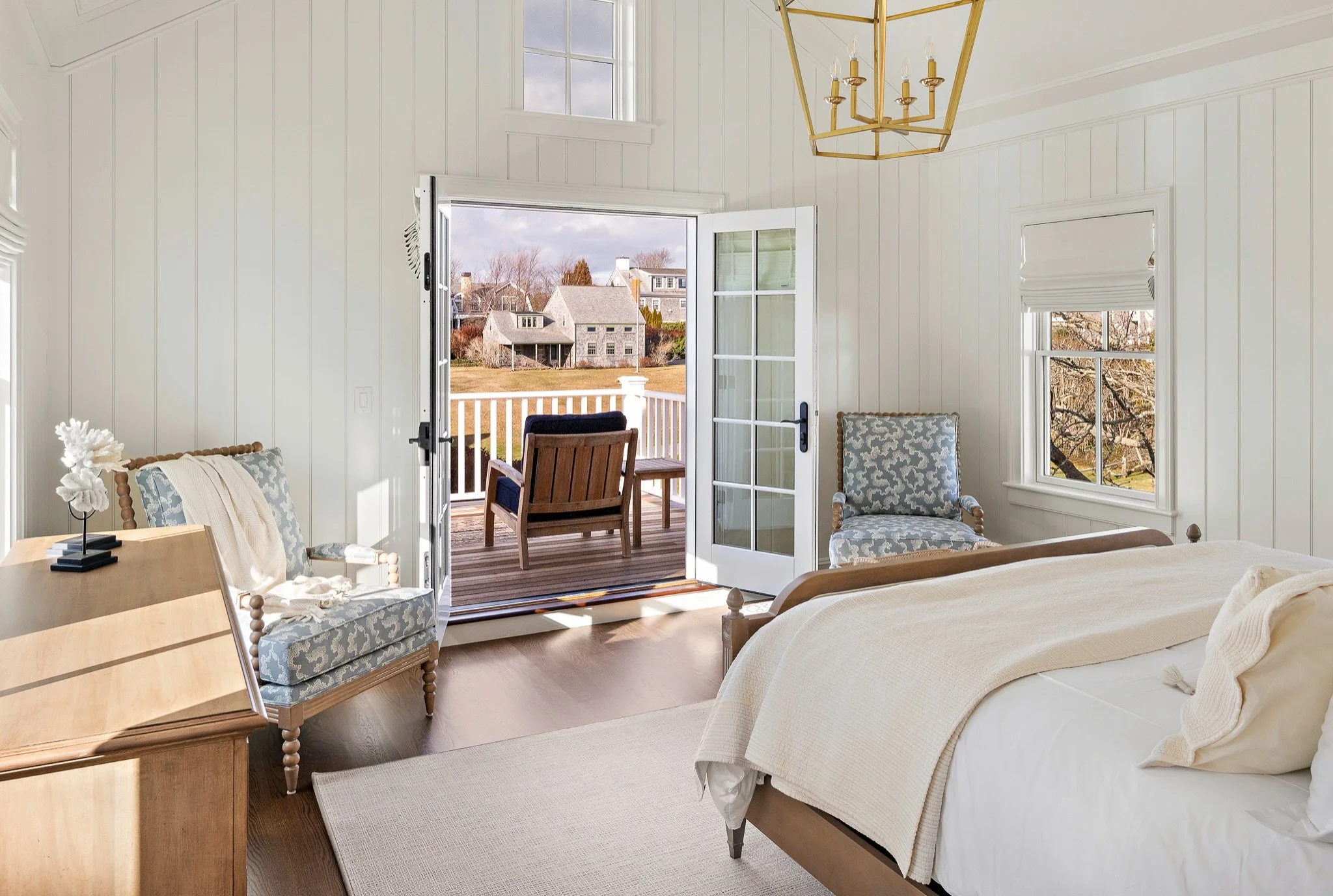 A look back at one of our completed projects on North Water Street. Vaulted ceilings, paneled walls, and French doors opening onto a private deck bring this bedroom together. 

#edgartown #primarybedroom #customhomes 

Architect: @patrickahearnarchit