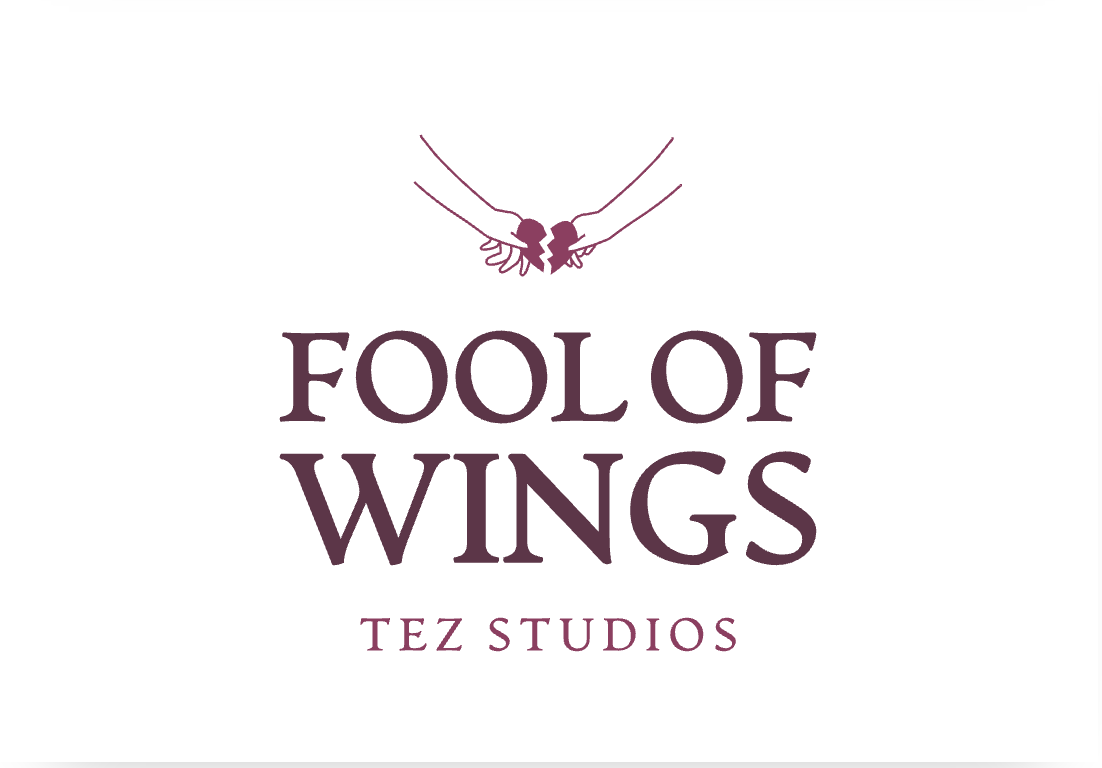 Logo for Fool of Wings Productions featuring two hands holding a broken heart with wings.