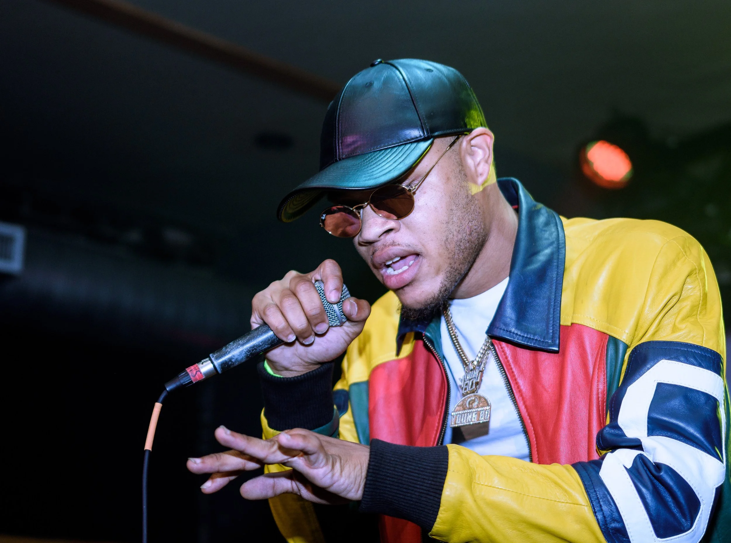An artist performing on a stage.
