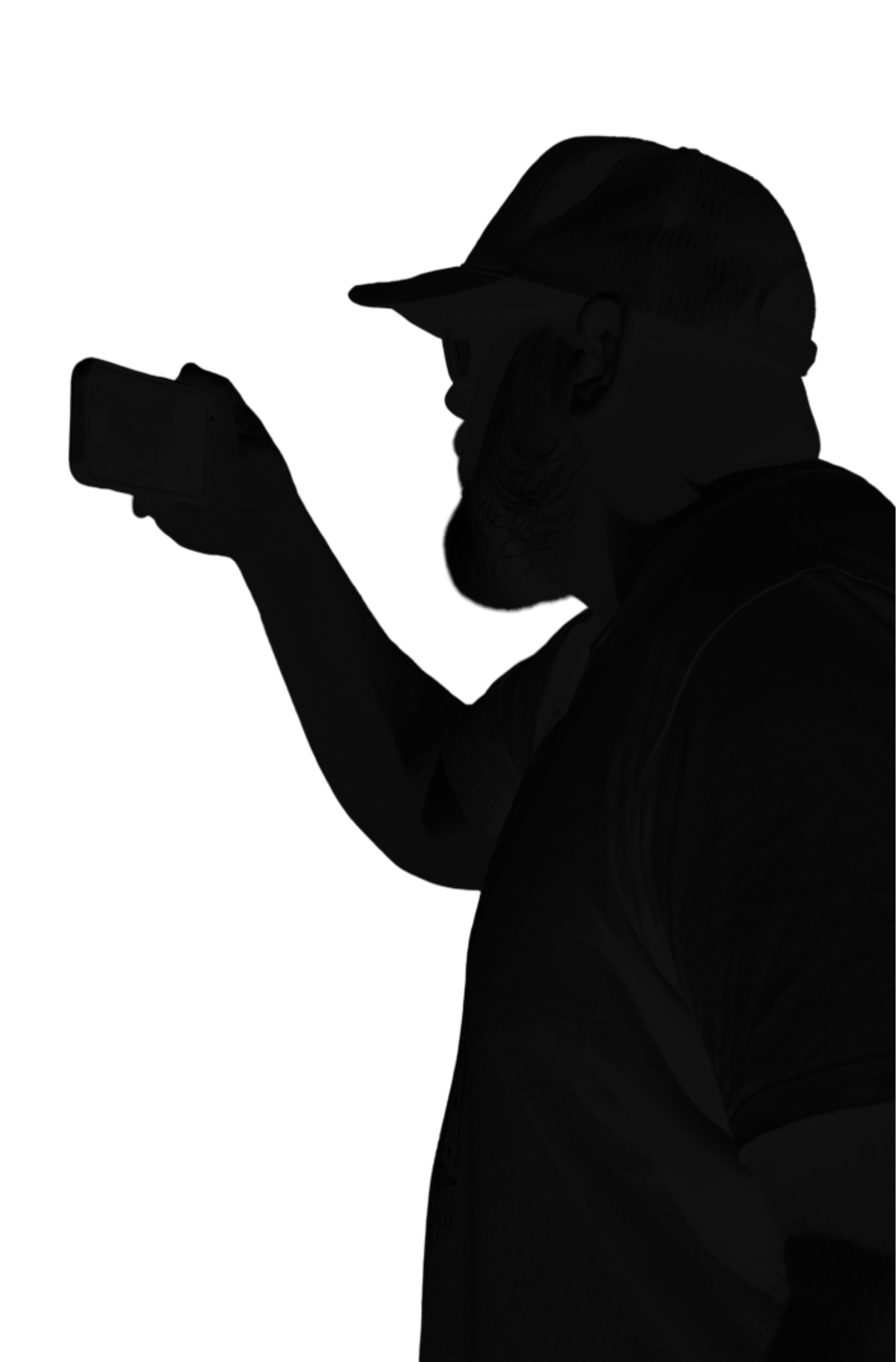 Silhouette of a person wearing a cap and sunglasses, holding a smartphone, against a plain background.