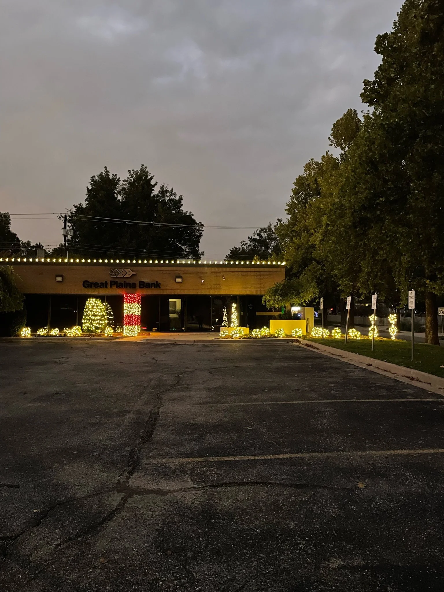Holiday roofline and landscape lighting at Great Plains Bank, a commercial install by First Line Services in OKC, Oklahoma.