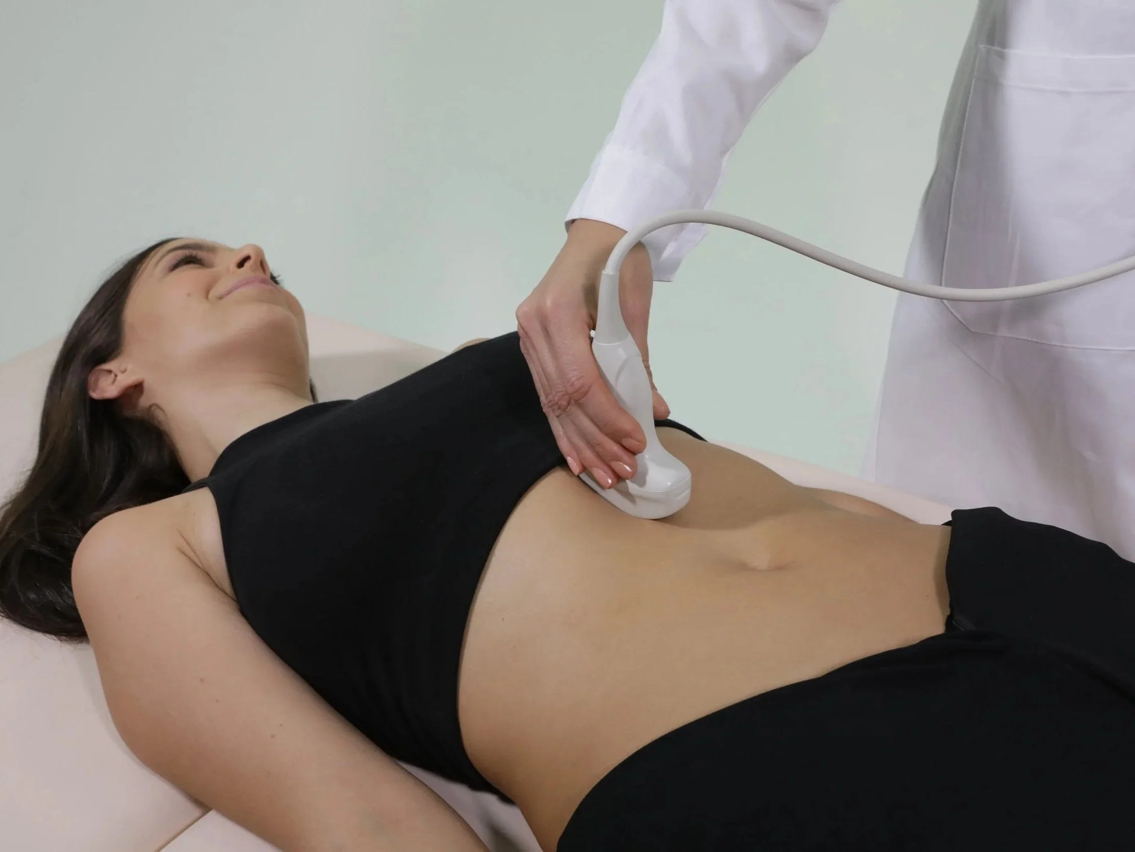 EchoLight device performing a lumbar spine scan for bone density assessment