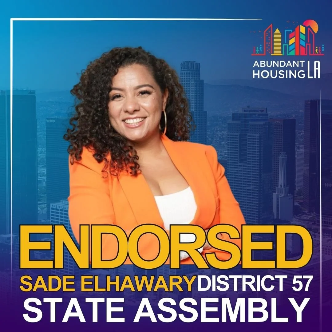 Political campaign poster featuring Sade Elhawary, an endorsed candidate for District 57 State Assembly, wearing an orange blazer, with a city skyline in the background, and the logos and text for Abundant Housing LA.