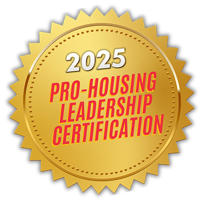 Gold circular seal with jagged edges stating "2025 Pro-Housing Leadership Certification" in red and white text.