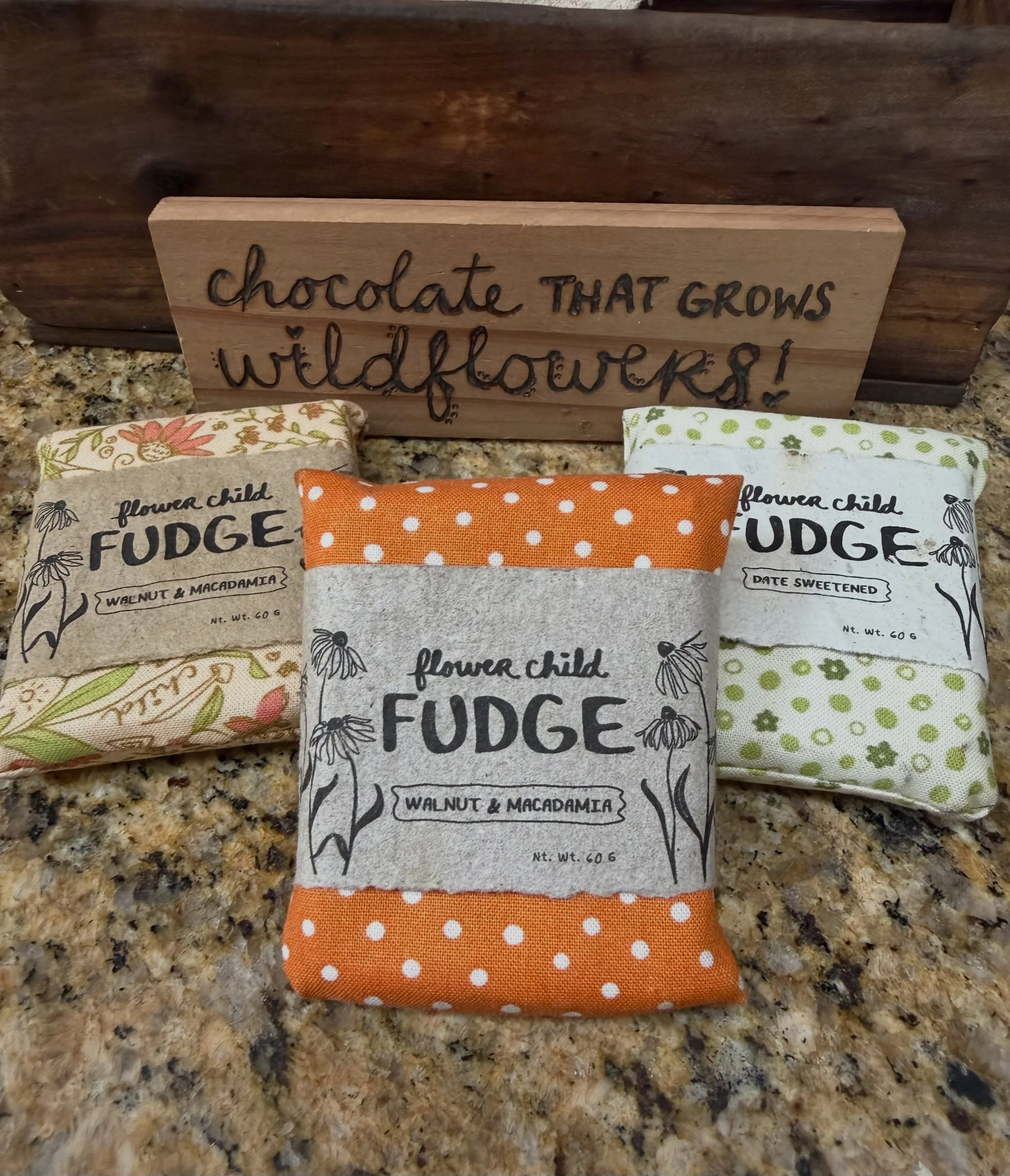 Have you tried Flower Child Fudge yet?
It&rsquo;s a fudgy treat, made from only whole food ingredients. It&rsquo;s wrapped in a reusable, organic cloth and plantable (hand-pressed) seed paper!
It makes a great gift for someone you love (including you