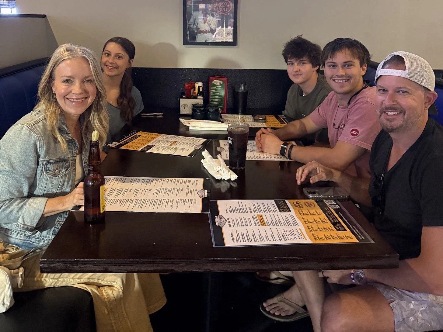 Angie Mizzell and her Family at dinner in a restaurant