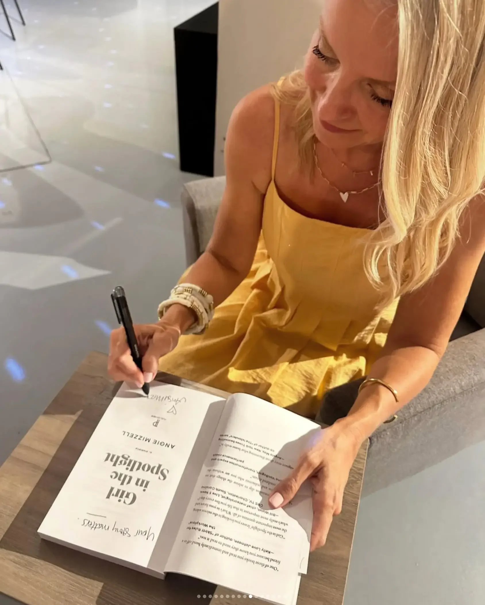 Angie Mizzell signing her book Girl in the Spotlight