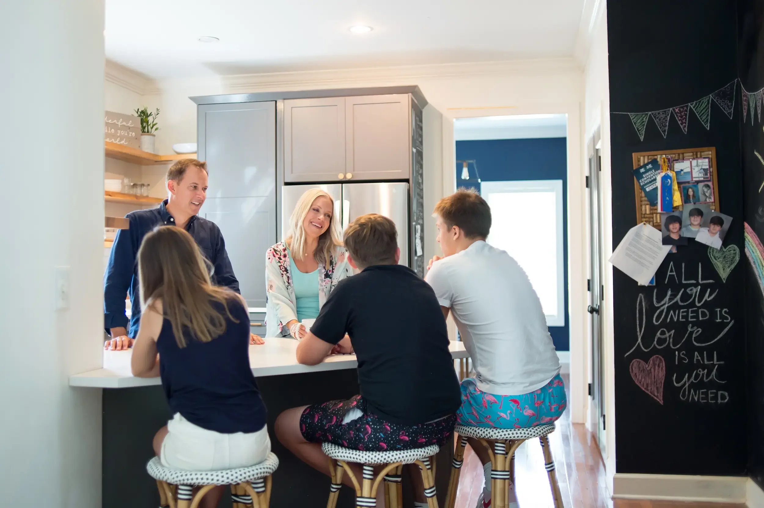 Angie Mizzell with her family in her kitchen.